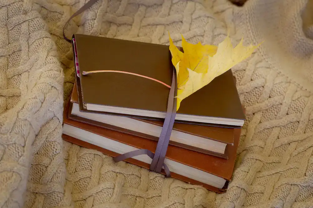 Stack of artisan journals with ribbon markers