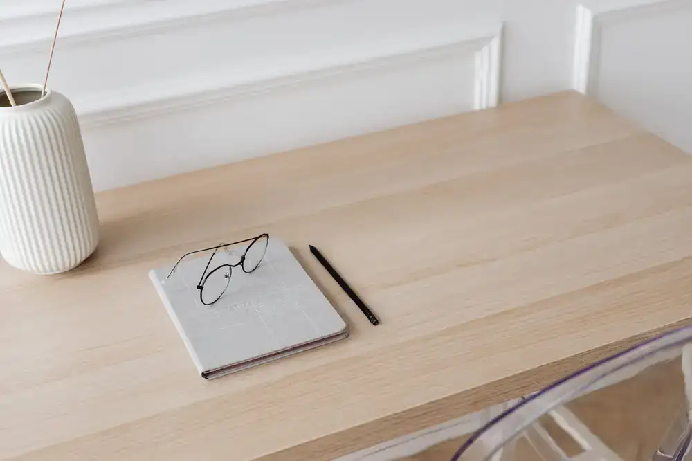 A clean desk setup with fine stationery notebooks and pens