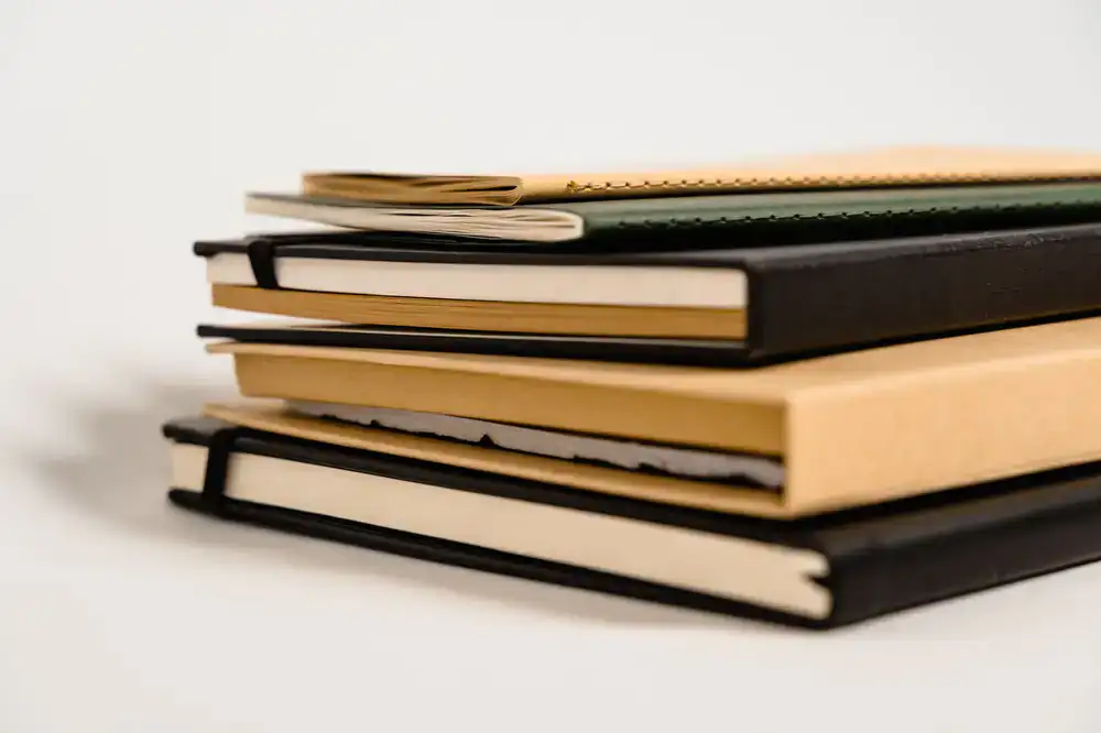 Stack of premium hardbound journals and notebooks